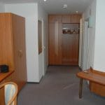 Wardrobe area in guest room at Parkhotel Goldlinde, Bodenwerder.
